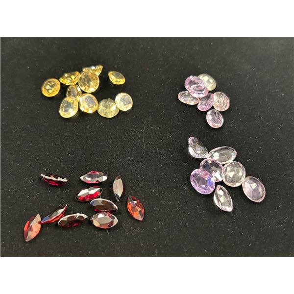 ASSORTED GEMS INCLUDING; 10 CITRINE, 10 GARNATES, & 14 AMETHYSTS. VARIOUS SIZES AND SHAPES