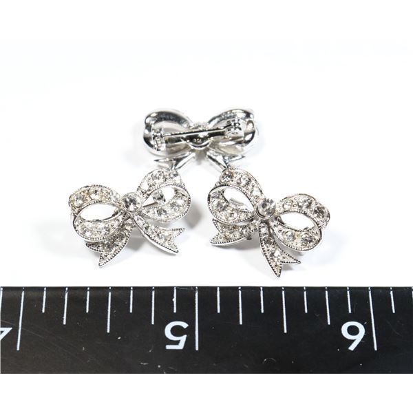 THREE SILVER TONE BOW BROOCHES