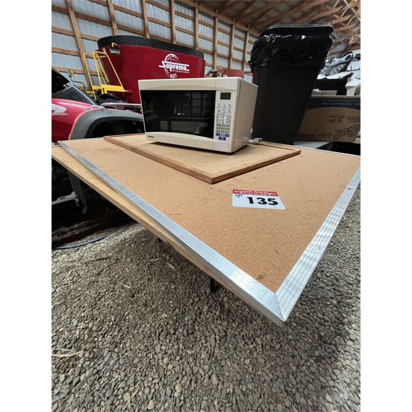 Folding Table, 3 cork boards and a microwave.