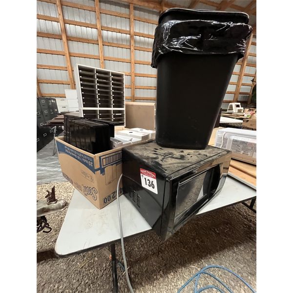 Microwave, files and binders. 4 garbage cans.