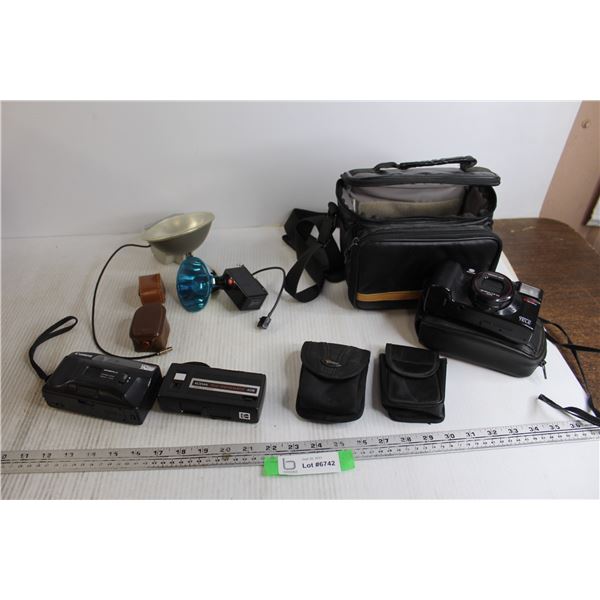 Assorted Kodak, Canon, and Minolta Cameras with Accessories