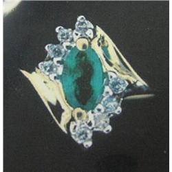 10 K Yellow Gold Emerald Ring accented with Diamonds. Emerald Approx 0.15 carats, Diamonds Approx. 0
