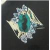 Image 1 : 10 K Yellow Gold Emerald Ring accented with Diamonds. Emerald Approx 0.15 carats, Diamonds Approx. 0