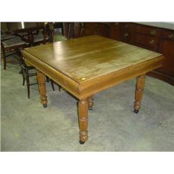 5-LEGGED OAK TABLE; PULL OUT LEAFS ON END; TOP HAS WEAR IN FINISH