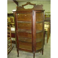 OAK CHINA WITH CURVED GLASS SIDES; CARVED CLAW & BALL FEET WITH WOOD SHELVES