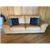 Image 1 : Leather Natuzzi Light Tan Couch With Four Throw Pillows- 91L x 24D x 30H