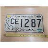 Image 1 : Sunny Manitoba "100,000 lakes" license plate CE 12-87