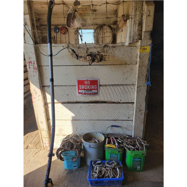 Qty of Horse shoes & misc. on wall