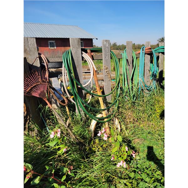 Hose on the fence & misc. on side of bldg.