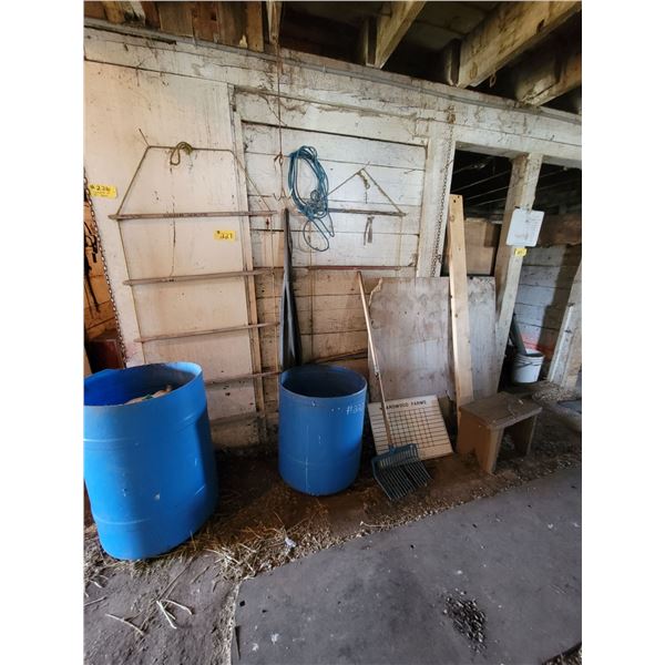 Barrels & misc. in front of wall