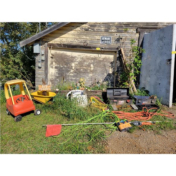 Contents outside of garage. Little tike car, hoses, ext. cords, tool boxes, garden décor etc.