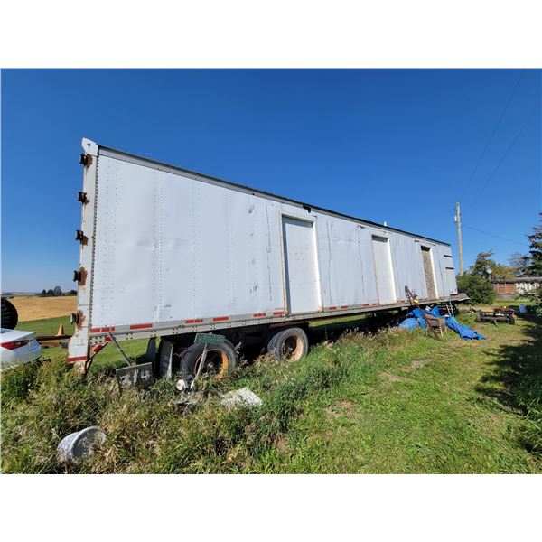 Lot (311 & 312) 1987 Roussy 48 ft Tandem Van, Roof is good c/w steps & has a key. Has one flat tire.