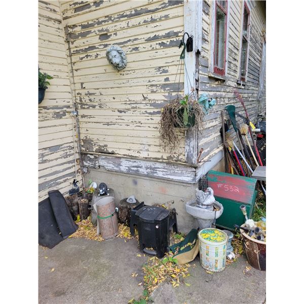 Qty of lawn ornaments, rakes, brooms, dog house, barrel and misc.