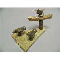 6 1/2" Soapstone carving, Kayaker w/ 2 seals by James Sugar