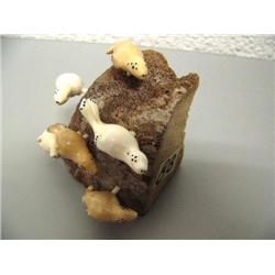 6 Swimming Seals Carved from Fossilized Walrus Teeth by Robert Kokuluk (1)