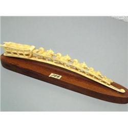12" Ivory Dog Team Nome, c.1900, has been restored, appears lead dog is missing, Sled is packed with