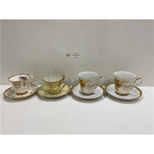 Set Of Four Tea Cups And Saucers