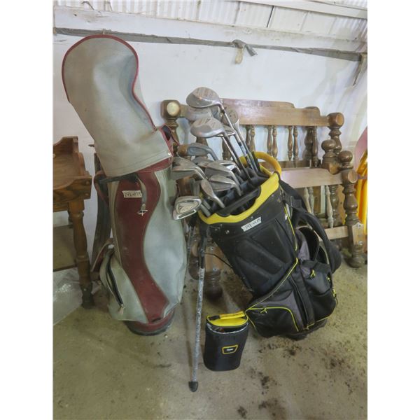2 golf bags with clubs, golf balls, tees, etc.