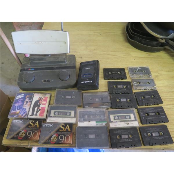 lot of cassette tapes, tape player and Archer tv antenna