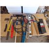 Image 1 : assorted levels , hatchet , jumper cables , carpenters square