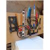 Image 3 : assorted levels , hatchet , jumper cables , carpenters square