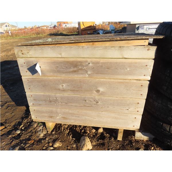 home made solid wood box filled with seasoned firewood