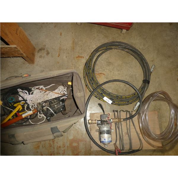 tool bag w/ contents: rope, tent pegs, hammer,