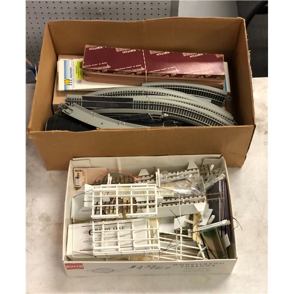 2 boxes full of model train parts