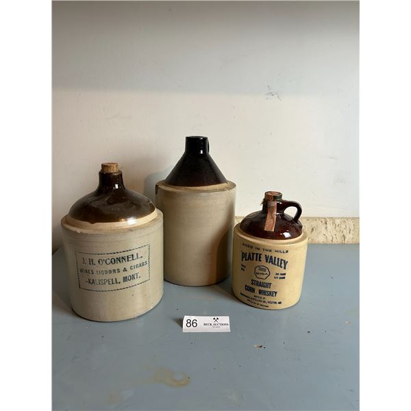 Assortment Of Moonshine Jugs Various Sizes