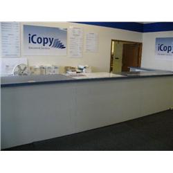 Entryway at I Copy - Counter with contents: telephone system, cash register, file cabinet, metal she