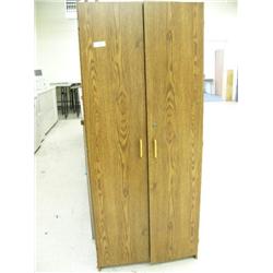 Wooden storage cabinet with assorted office supplies