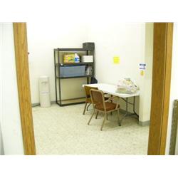 Whole Kitchen area: Microwave on counter only, refrigerator, water dispenser, metal shelving unit, t