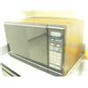 Image 3 : Whole Kitchen area: Microwave on counter only, refrigerator, water dispenser, metal shelving unit, t