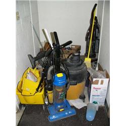 Lot of cleaning supplies: Vacuums, mop buckets etc
