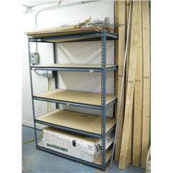 Metal shelf with paper and wooden 2x4's