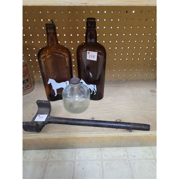 old bottles with horse design axle wrench and bottle