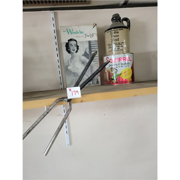 Curling iron, antique Wonder-Bra (no bra), jug and peanut butter tin