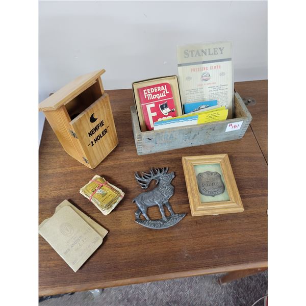 police badge, pewter elk, Kraft cheese box with misc. papers