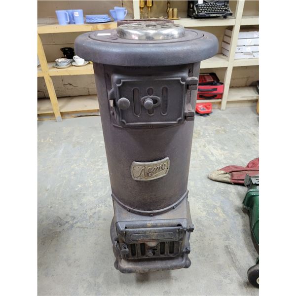 Old ACME stove with fire brick
