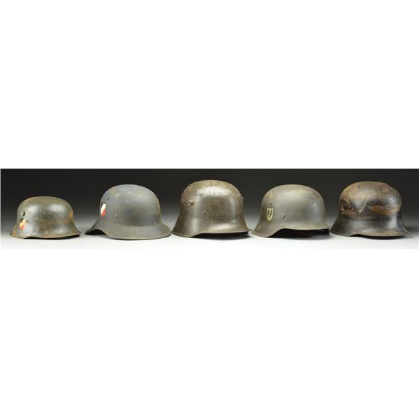 5 WWI & WWII AXIS HELMETS.