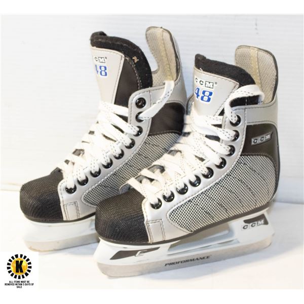 PAIR OF KIDS SIZE 12 CCM 48 HOCKEY SKATES