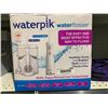Image 1 : WaterPik Oral Care System Water Flosser