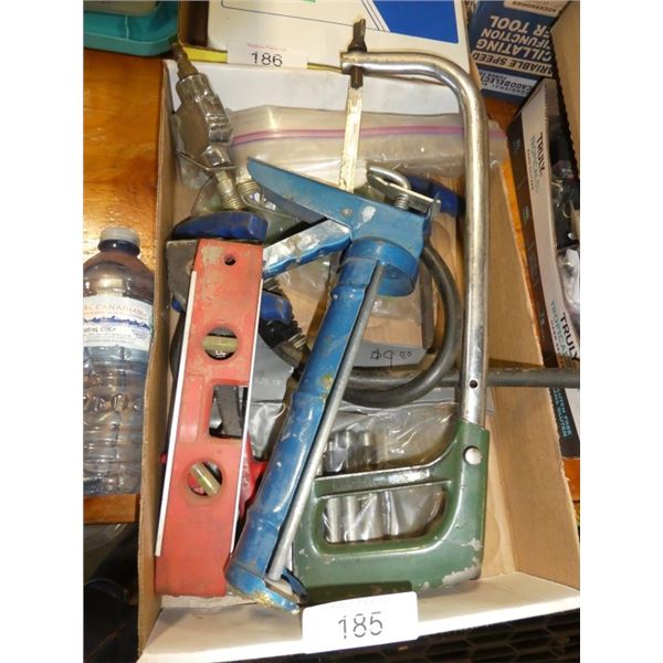 hacksaw, caulking gun, air nozzle, torpedo level,