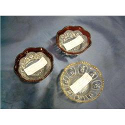 2 cranberry cut glass bowls, 1 gold trimmed bowl