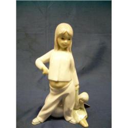 Japanese Porcelain figurine-Girl w/doll & beach ba