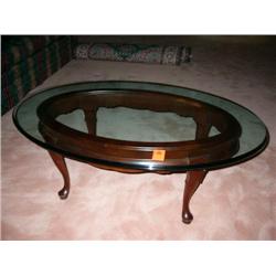 mahogany oval glass top coffee table (gordons)