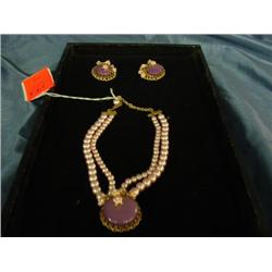 2 strands of lavendar pearls with lavendar stone -