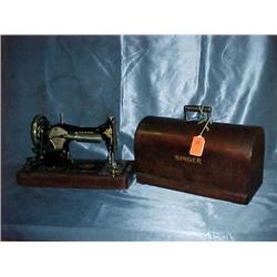 Very old singer sewing machine with wooden dome li