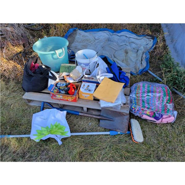 Pallet of misc. toys, manuals, shovel