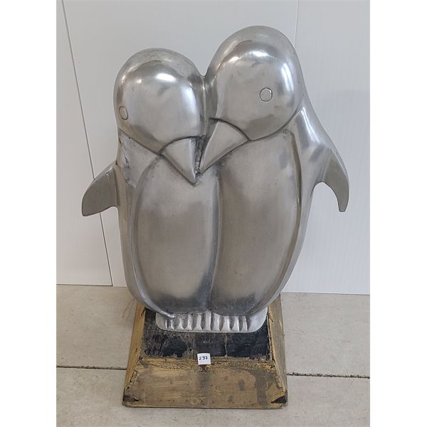 PAIR OF POLISHED CHROME PENGUINS ON WOOD BASE 